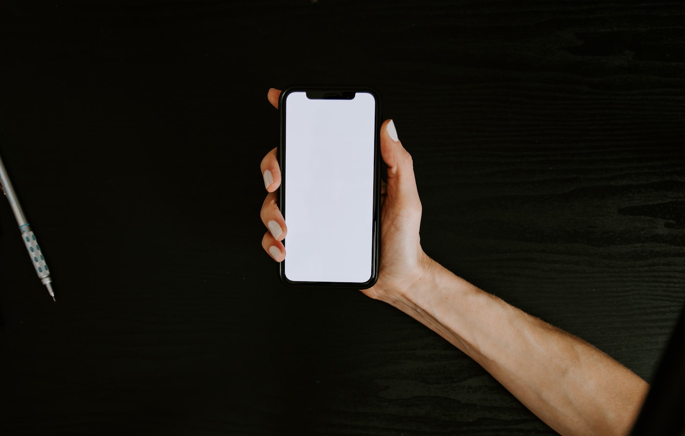 Holding a phone to write an NFC sticker
